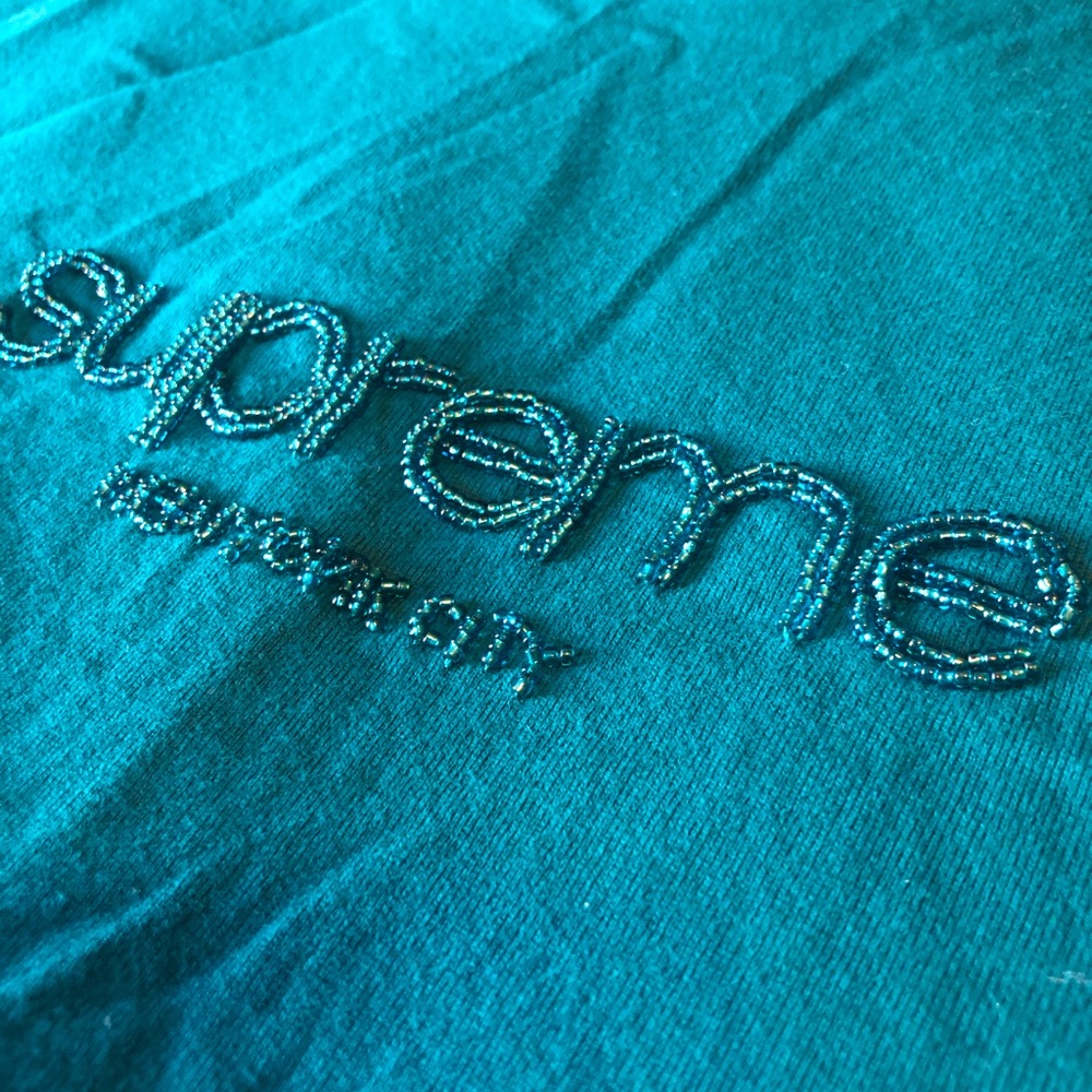 Authentic . Never been worn Supreme teal green small tee shirt. With beads